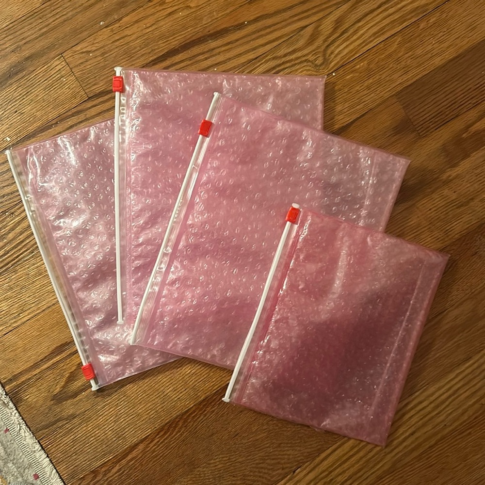 4 glossier pink pouches